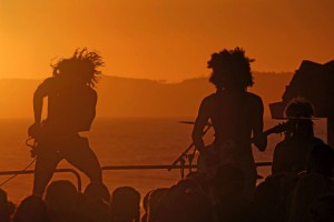 As the sun prepares to set over Dana Point within a week of the summer equinox,  the band Wigs and Ties leaps into action in San Clemente's summer beach concert series, June 15. (Photo by Fred Swegles, Orange County Register/SCNG)