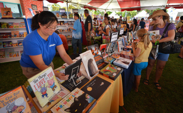 Michelle Tang of Mrs. Nelson's Book Fair Company keeps the children's books for sale organized during the 10th Annual Orange County Children's Book Festival at Orange Coast College.

STEVEN GEORGES, FOR THE REGISTER

/// ADDITIONAL INFORMATION: 

The 10th Annual Orange County Children's Book Festival at Orange Coast College in Costa Mesa.

9/29/13 Slug:  cu.schools.1001.books

STEVEN GEORGES, FOR THE REGISTER