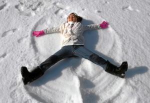 Leilani Mantecon, 6, creates a snow angel. The Port of Los Angeles presented a winter wonderland for children and families at Wilmington Waterfront Park on Saturday afternoon.  Wilmington, December 6, 2014. (Photo by Brittany Murray / Daily Breeze)