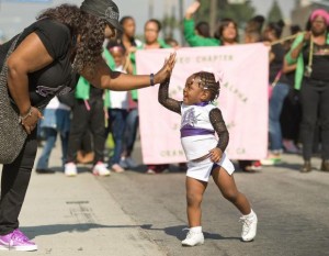 Zoey Harris, 2, with Cheer LA, charms the crowd during the 35th Black History Parade & Cultural Faire in downtown Anaheim on Saturday.

///ADDITIONAL INFORMATION:   – MINDY SCHAUER, ORANGE COUNTY REGISTER –
shot 020715
schauer.020715.BlackHistoryParade.0208
This year, the Black History Parade & Cultural Faire marks its 35th anniversary in Anaheim.