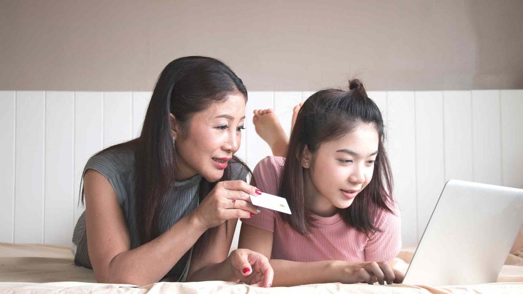 mother-daughter-using-computer-buying-online