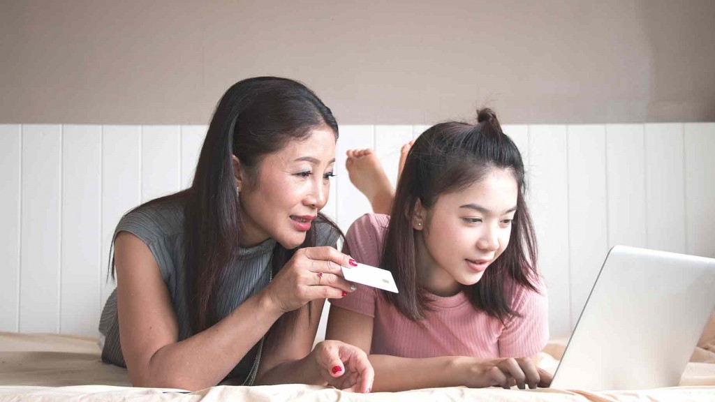 mother-daughter-using-computer-buying-online